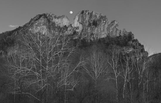 A black and white photograph taking a wide angle view of West Virginia's Seneca Rocks in black and white, by photographer David S. Johnston.
